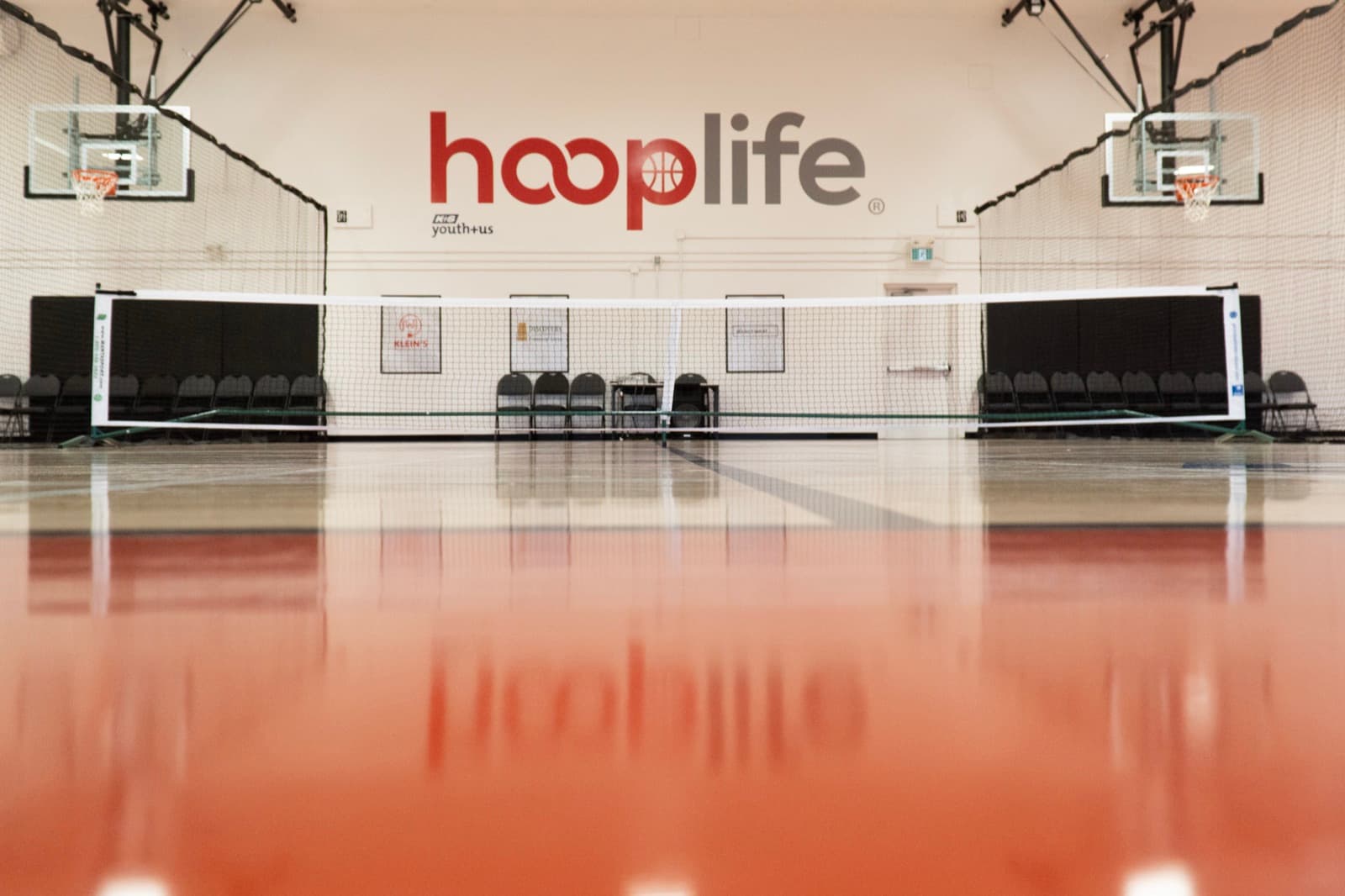The indoor court at the HoopLife Centre with both pickleball nets up